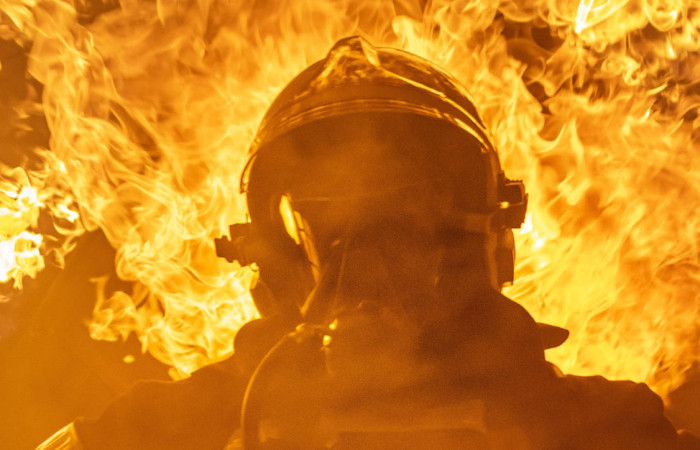 fireman-standing-near-fire-on-building-3448641.jpg